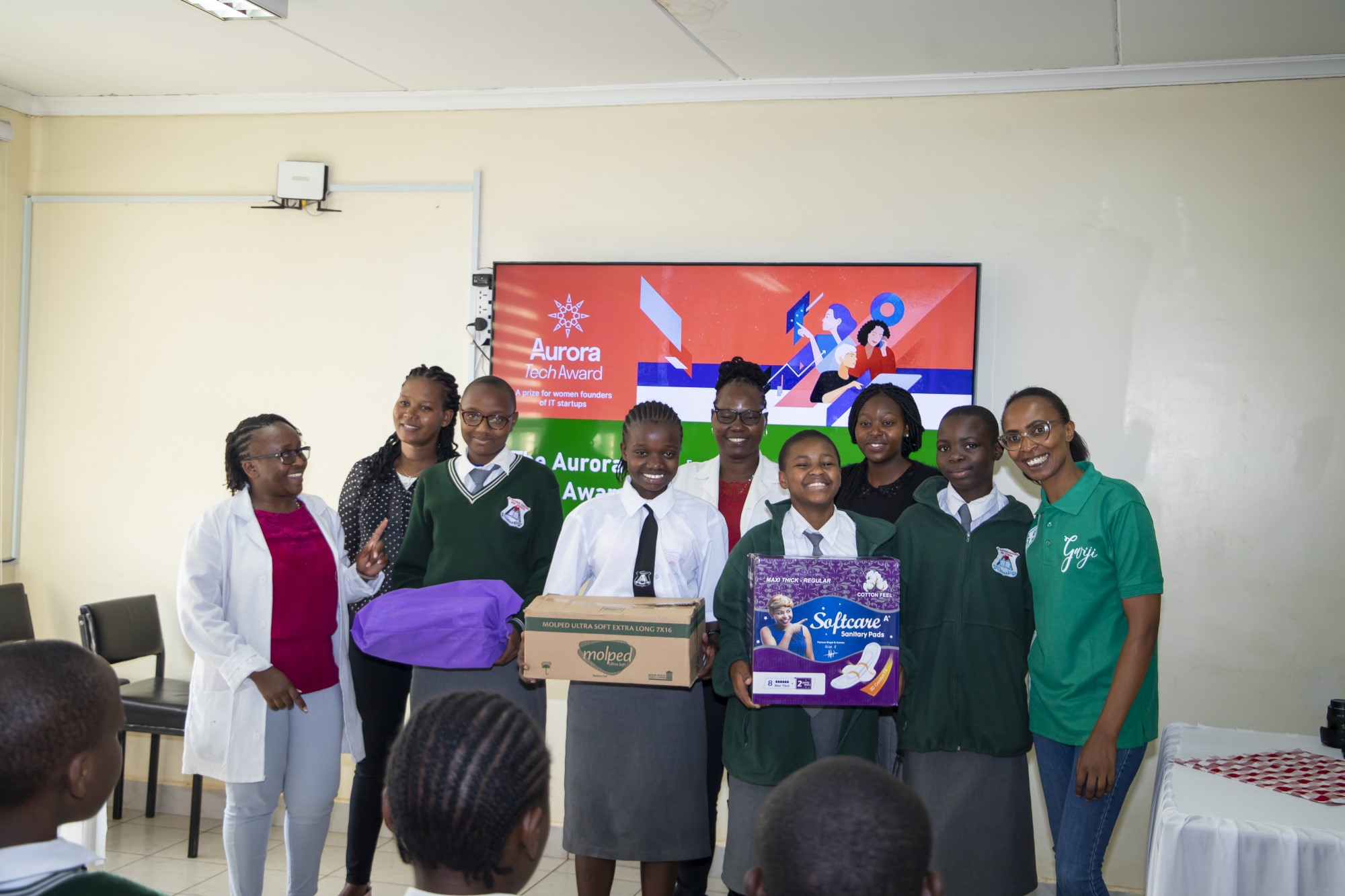 Elizabeth Mwangi, Founder Gwiji, donates 50 sanitary pads to St.Aloysius Gonzaga Sec. School